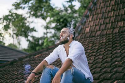 1 bearded-man-smoking-roof
