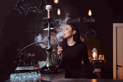 1 smokes-hookah-while-sitting-counter-nightclub
